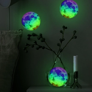 Detailed glowing texture of colorful nebula moon wall stickers in a dark bedroom