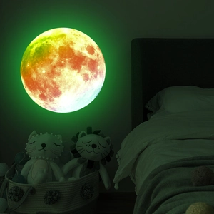 Luminous rainbow moon wall sticker showing vibrant gradient glow on bedroom wall