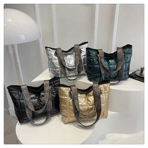 Quilted puffer tote bags in silver, green, black, and gold with ethnic patterned straps