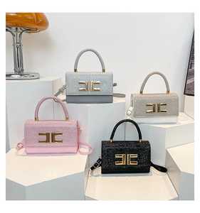 Detail showing elegant handbags in four colors with gold H-buckle and sleek top handles