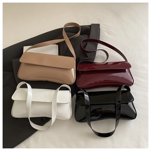 Glossy patent leather baguette bags in beige, burgundy, white, and black colors