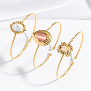 Lot de trois bracelets dorés rétro avec pierre de marbre, œil de chat et ambre