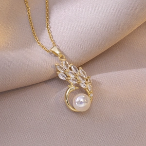 Elegant gold peacock necklace featuring sparkling zircons and a round white pearl pendant