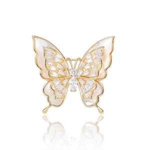 Elegant gold butterfly brooch with natural mother of pearl wings and zircon accents
