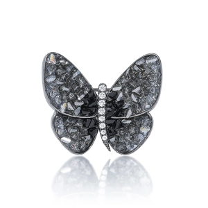 Elegant silver butterfly brooch with dark shell wings and sparkling zircon body detailing