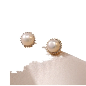 Elegant halo style freshwater pearl earrings with shimmering zircon border and gold finish
