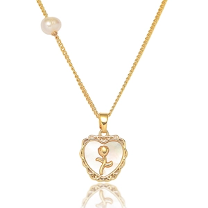 Detail of heart shell pendant with gold rose and freshwater pearl on a golden chain