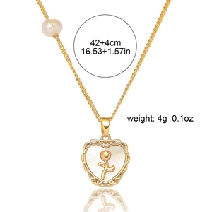 Detail showing gold heart necklace with rose shell inlay and 42+4cm size specifications