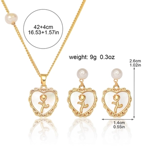 Golden heart necklace and earring set with rose patterns and freshwater pearl accents