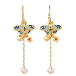Detail of long drop butterfly earrings with colorful enamel, pearls and heart charms