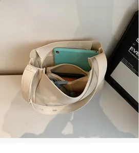 Interior view of tote bag with inner pouch showing large capacity and adjustable strap