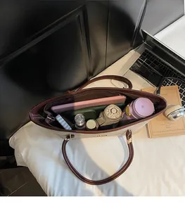 Top view of spacious interior of a beige tote bag showing high storage capacity