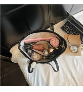Interior view showing the large capacity and multiple functional compartments of the tote bag