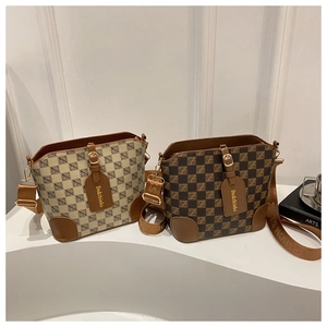 Detail of checkered bucket bags in beige and coffee with wide jacquard shoulder straps