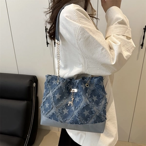 Denim star print tote bag with frayed diamond quilting and golden chain strap