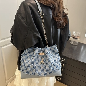 Blue and white checkered denim bucket bag with gold deer charm and chain strap