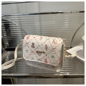 Detail of white pleated crossbody bag with colorful cartoon animal and floral prints