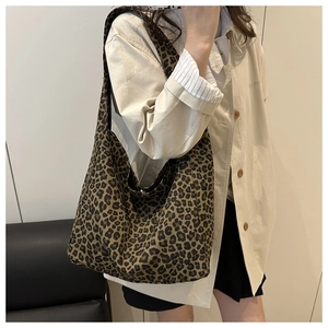 Close-up of leopard print canvas tote bag showing high-capacity design and fabric texture