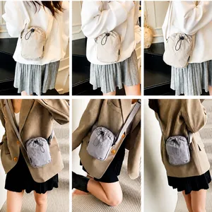 Detailed views of the mini nylon drawstring crossbody bag shown in beige and light gray