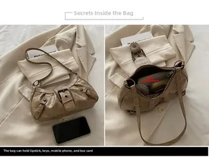 Detail view of khaki retro underarm bag showing interior space for phone and makeup