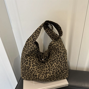 Leopard print canvas tote bag for women with wide shoulder strap in classic hobo style