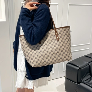 Classic large tote bag with vintage letter print and brown leather straps for daily commute