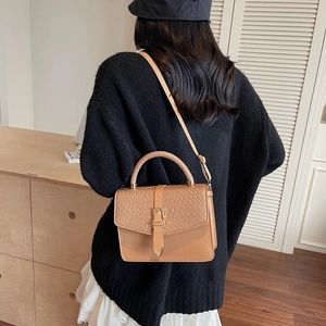 Fashionable brown square crossbody bag with quilted lid and top handle for women