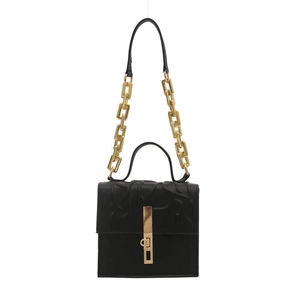 Minimalist black quilted handbag with chunky gold chain strap and metal lock closure