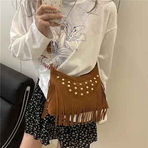 Vintage brown suede fringe crossbody bag with gold studs and adjustable strap