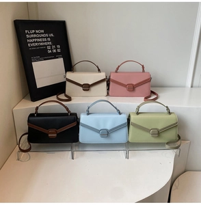 Group display of chic contrast-trim crossbody bags in beige, pink, black, blue, and green