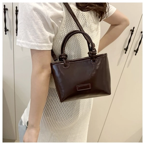 Polished coffee brown PU leather tote bag with dual handles and crossbody strap