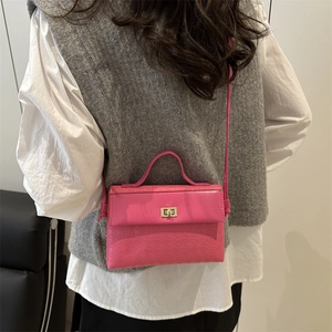 Vibrant pink PU leather handbag with embossed texture and gold lock for casual commute