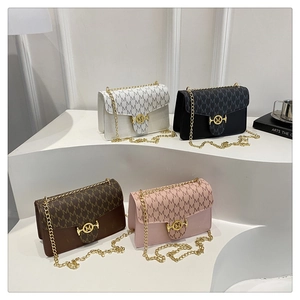 Detail of trendy small square chain bags with letter prints and gold M-shaped buckles