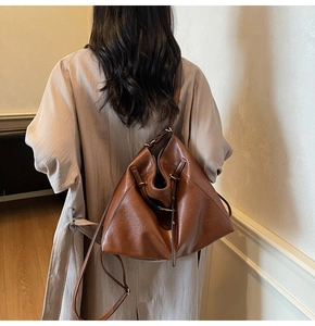 Detail of soft brown leather tote bag showing vintage oil skin texture and slouchy style
