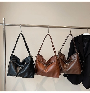 Three classic large Hobo shoulder bags in black, caramel and dark brown leather