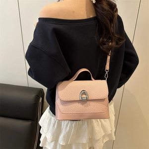 Pink patchwork underarm bag with woven flap and silver buckle for stylish women