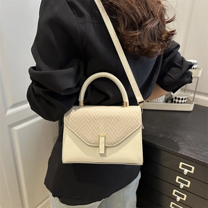 Chic beige structured handbag with woven texture flap and gold hardware for women