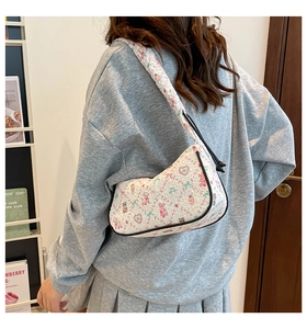 Quilted tote bag with cute cartoon animal prints shown on model for daily commuting