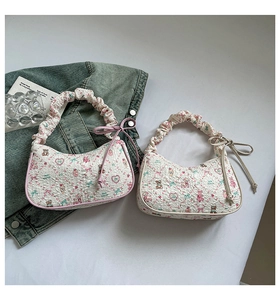 Detailed view of quilted tote bags featuring cute cartoon prints and bow decorations