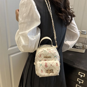 White mini crossbody bag with cute cartoon prints and golden chain strap for women