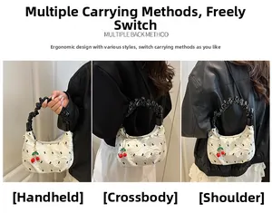 Borsa a mano in tela a pois con tre modalità di trasporto: a mano, a tracolla e a spalla