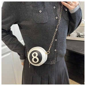 Detail of creative Billiard 8-Ball mini crossbody bag with golden chain and zipper