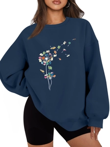 Detail showing dandelion book print on navy blue thick fleece sweatshirt for women