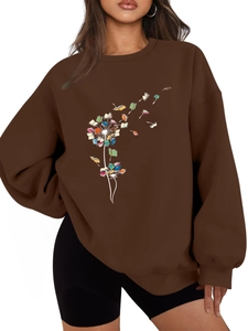 Detail of dark brown dandelion book graphic sweatshirt with ribbed cuffs and hem