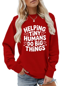 Detail of red crewneck sweatshirt featuring white Helping Tiny Humans printed text