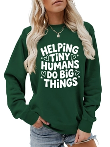 Detail of white text print on dark green crewneck sweatshirt for educators and teachers