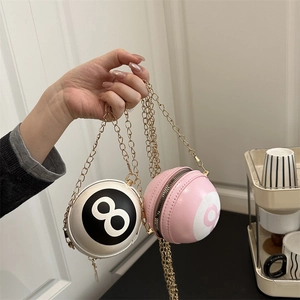 Miniature round crossbody chain bag with billiards ball design in black and pink