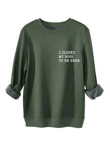 Detail of warm grey fleece lining on dark green sweatshirt with I Closed My Book print