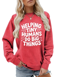 Close-up of red crewneck sweatshirt featuring white Helping Tiny Humans printed text