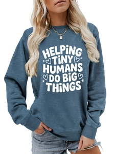 Close-up of Helping Tiny Humans Do Big Things print on a blue-grey crewneck sweatshirt